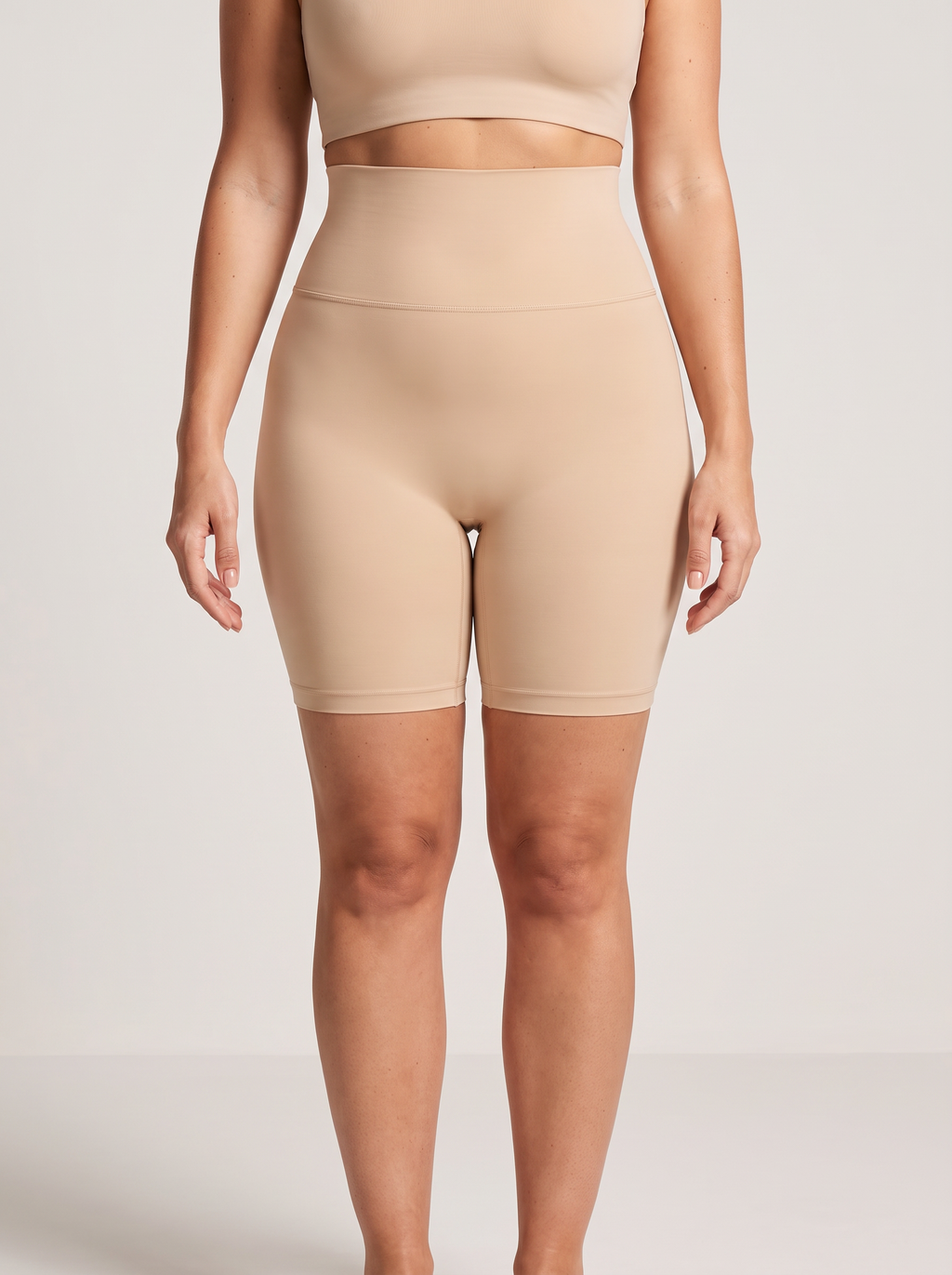 AI-generated model wearing the Everyday Sculpt high-waist mid-thigh shorts in Beige, straight-front detail view