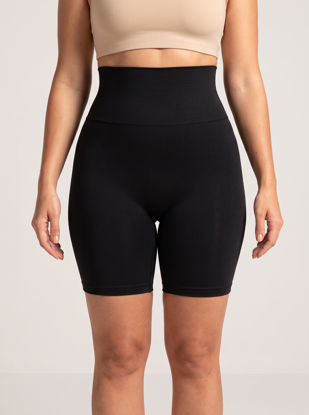 AI-generated model wearing the Everyday Sculpt high-waist mid-thigh shorts in Black, straight-front detail view