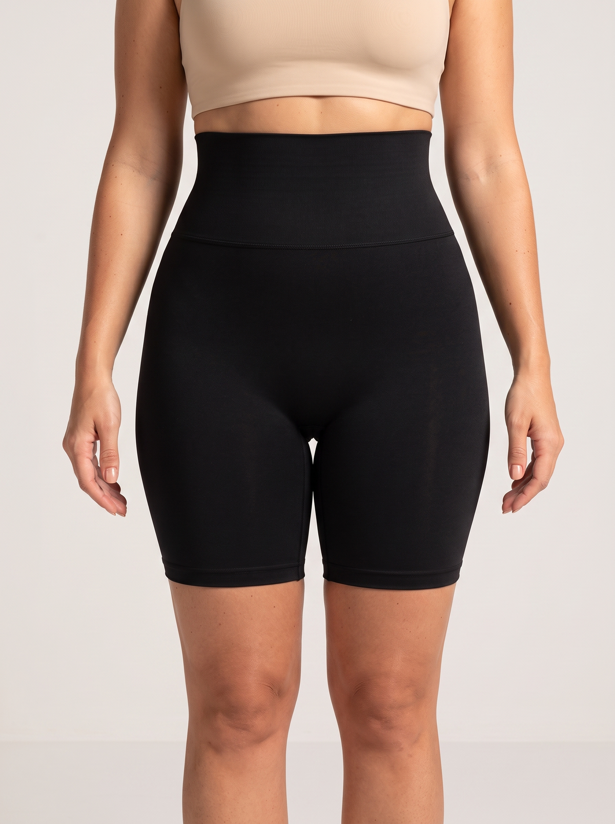 AI-generated model wearing the Everyday Sculpt high-waist mid-thigh shorts in Black, straight-front detail view