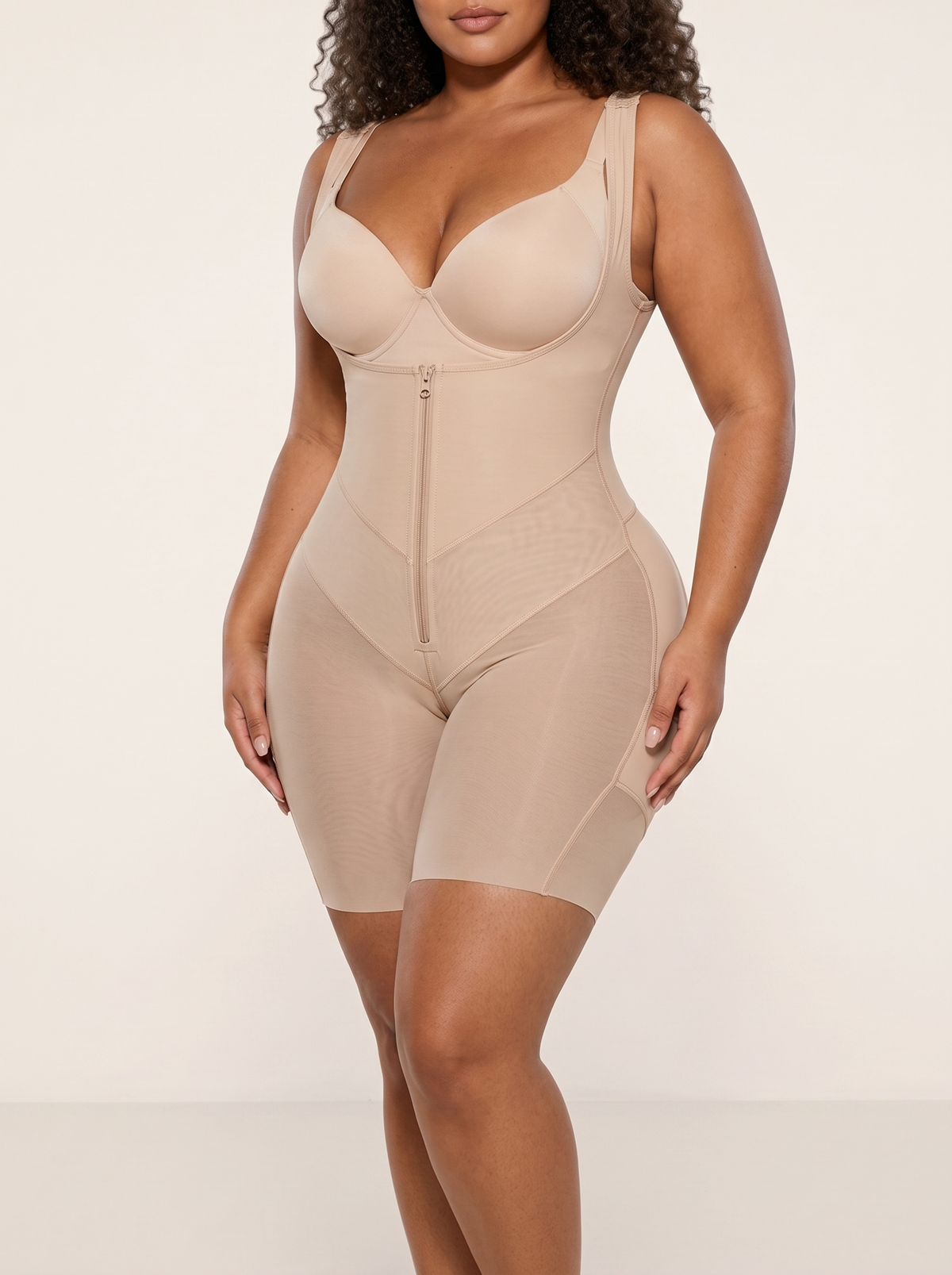 AI-generated model wearing the FlexFit open-bust zip-front mid-thigh bodysuit in Beige, front three-quarter view