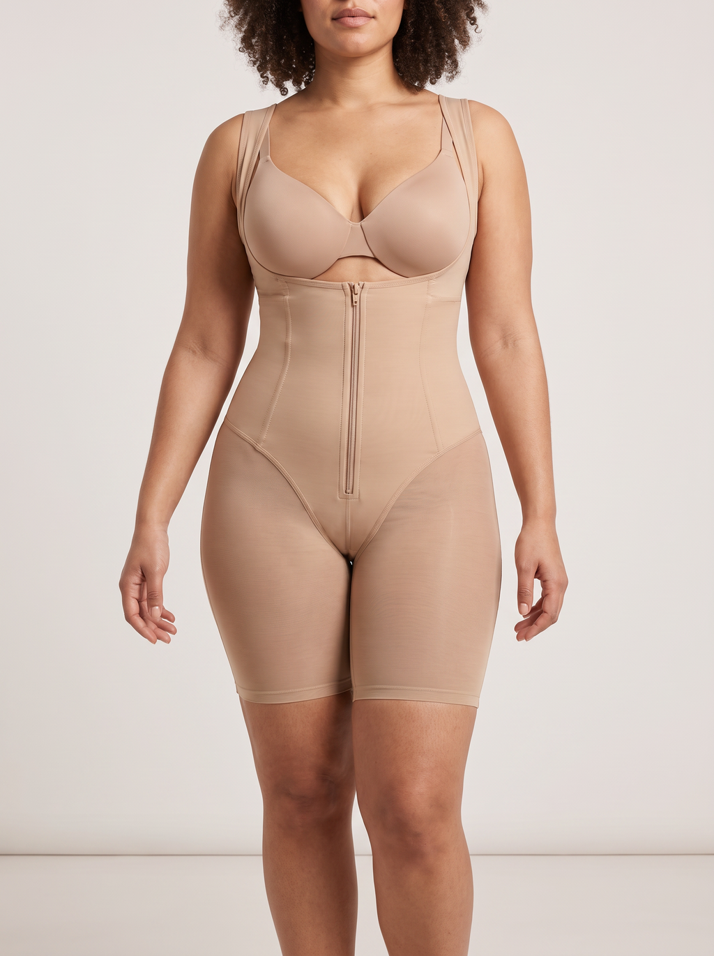 AI-generated model wearing the FlexFit open-bust zip-front mid-thigh bodysuit in Beige, straight-front detail view
