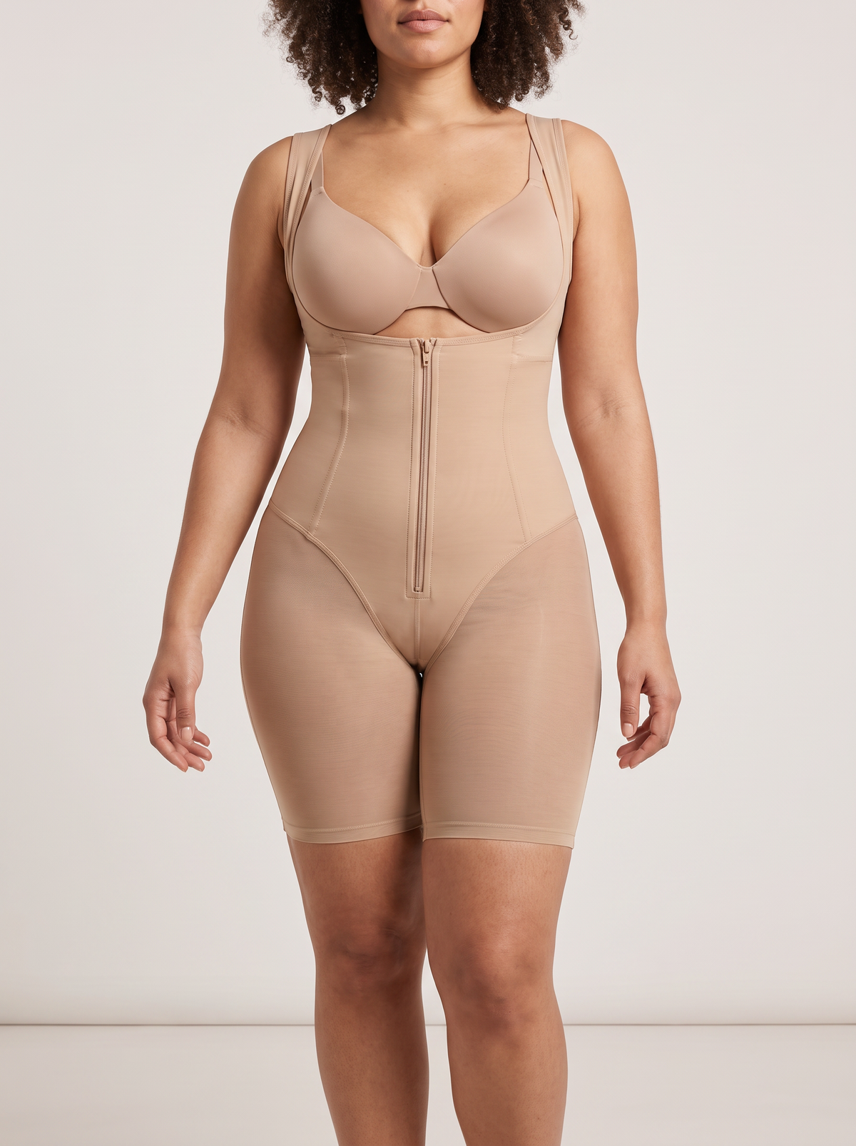 AI-generated model wearing the FlexFit open-bust zip-front mid-thigh bodysuit in Beige, straight-front detail view