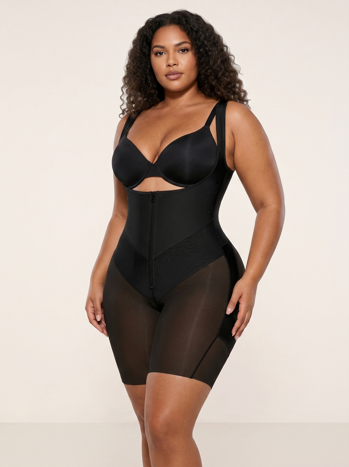AI-generated model wearing the FlexFit open-bust zip-front mid-thigh bodysuit in Black, front three-quarter view